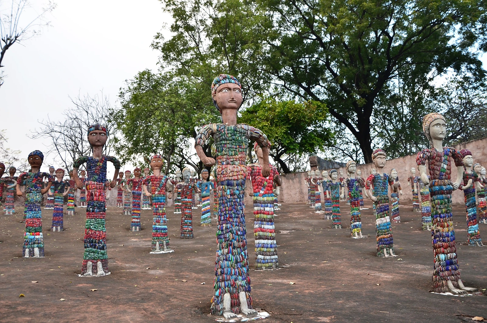 Rows of figures covered in broken bangles at Nek Chand's Rock Garden
