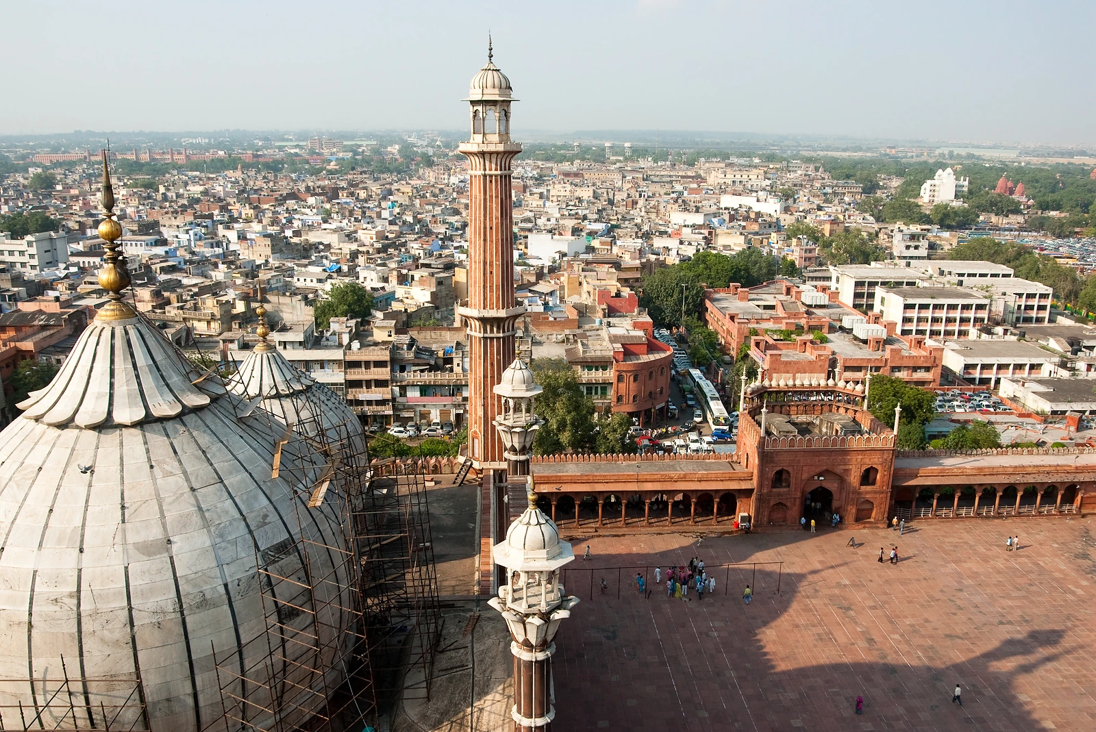 Domes and a minaret of the Jama Masjid above the rooftops of Old Delhi
